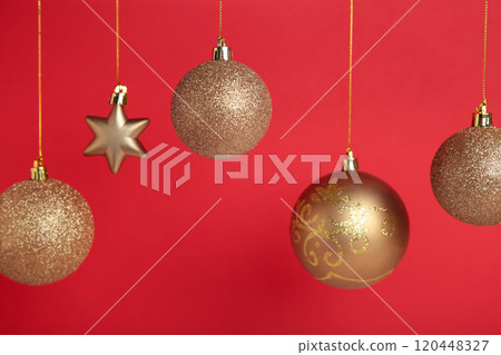 Golden christmas balls on red background with copy space. New Year 2022 Golden christmas balls on red background with copy space. New Year 2022 120448327