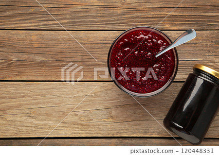 Plum jam on grey wooden background with copy space 120448331
