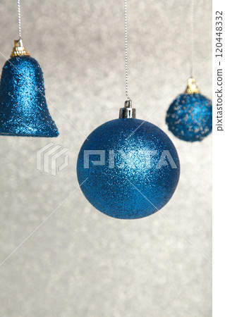 Shiny blue Christmas balls on glittering background. Shiny blue Christmas balls on glittering background. 120448332