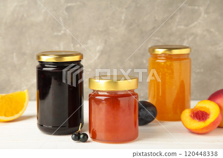 Homemade fruit jam in the jar on grey background. Top view 120448338
