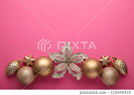 Gold Christmas decoration on pink background, top view, flat lay Gold Christmas decoration on pink background, top view, flat lay 120448416