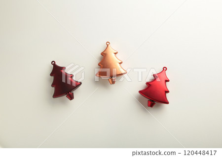 Gold and red christmas plastic fir tree on white background. Minimalism. Flat lay Gold and red christmas plastic fir tree on white background. Minimalism. Flat lay 120448417