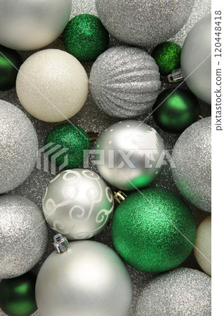 Green and silver christmas bauble balls background Green and silver christmas bauble balls background 120448418