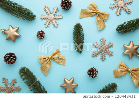 Christmas gold decoration on blue background. New Year composition 120448431
