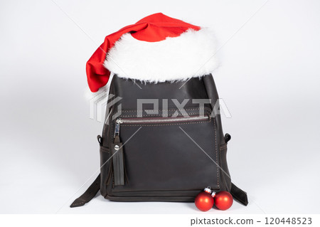 Leather Backpack With Santa Hat. Christmas for leather goods and handbags stores 120448523