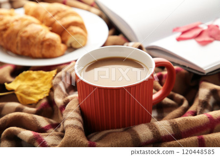 Hot coffee with croissant and autumn leaves on plaid - seasonal relax concept 120448585