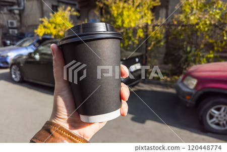 Сoffee paper cup in hand Сoffee paper cup in hand 120448774