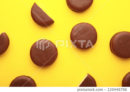 Choco pie chocolate coated snacks on yellow background. Choco pie chocolate coated snacks on yellow background. 120448786