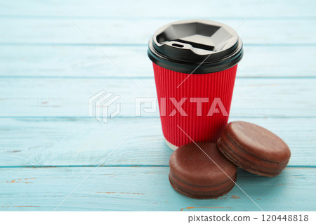 Choco pie chocolate coated snacks with cup of coffee on blue background. 120448818
