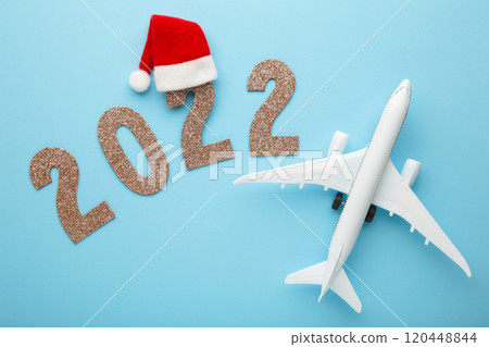 Christmas background with airplane and inscription 2022. Christmas holiday Christmas background with airplane and inscription 2022. Christmas holiday 120448844
