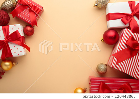Christmas background with decorations and gift boxes on beige background. 120448863