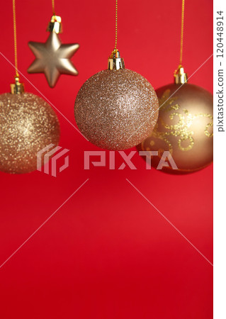 Golden christmas balls on red background with copy space. New Year 2022 Golden christmas balls on red background with copy space. New Year 2022 120448914
