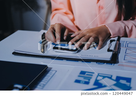 Young Asian business creative team work together, mobile application software design project. Brainstorm meeting, internet technology, smartphone web app designer, office coworker teamwork concept Young Asian business creative team work together, mobile application software design project. Brainstorm meeting, internet technology, smartphone web app designer, office coworker teamwork concept 120449047