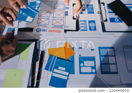 Young Asian business creative team work together, mobile application software design project. Brainstorm meeting, internet technology, smartphone web app designer, office coworker teamwork concept 120449058