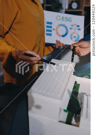 ESG environmental social governance display on laptop on eco-friendly company meeting with business people implementing environmental protection for clean and sustainable future ecology. Trailblazing 120449124