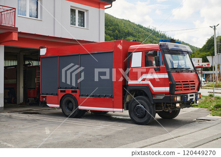 A state-of-the-art firetruck, equipped with advanced rescue technology, stands ready with its skilled firefighting team, prepared to intervene and respond rapidly to emergencies, ensuring the safety A state-of-the-art firetruck, equipped with advanced rescue technology, stands ready with its skilled firefighting team, prepared to intervene and respond rapidly to emergencies, ensuring the safety 120449270