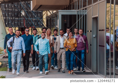 A diverse group of businessmen and colleagues walking together by their workplace, showcasing collaboration and teamwork in the company. 120449271