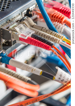 Server with patch cables plugged in ethernet ports Server with patch cables plugged in ethernet ports 120449330