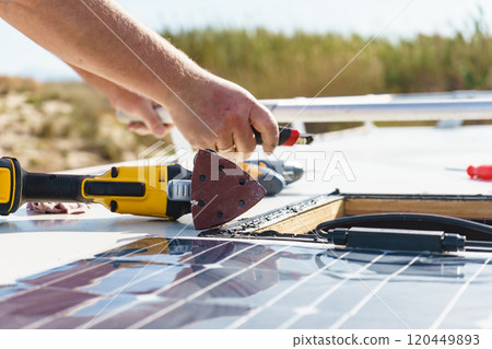 RV solar panel installation. Caravan roof repair RV solar panel installation. Caravan roof repair 120449893