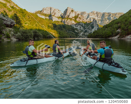 A group of friends enjoying having fun and kayaking while exploring the calm river, surrounding forest and large natural river canyons 120450080