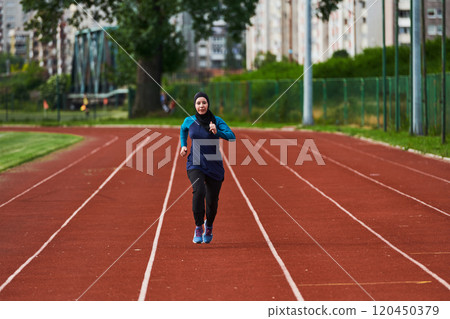 A muslim woman in a burqa sports muslim clothes running on a marathon course and preparing for upcoming competitions A muslim woman in a burqa sports muslim clothes running on a marathon course and preparing for upcoming competitions 120450379