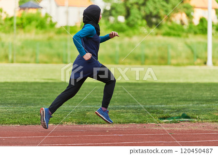 A muslim woman in a burqa sports muslim clothes running on a marathon course and preparing for upcoming competitions A muslim woman in a burqa sports muslim clothes running on a marathon course and preparing for upcoming competitions 120450487