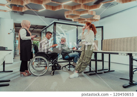 Young group of business people brainstorming together in a startup space, discussing business projects, investments, and solving challenges. 120450653