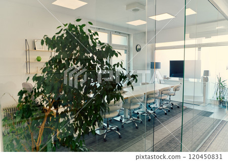 Modern Glass Office with Chairs, Projector, and Greenery Modern Glass Office with Chairs, Projector, and Greenery 120450831