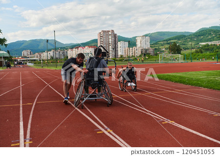 A cameraman filming the participants of the Paralympic race on the marathon course A cameraman filming the participants of the Paralympic race on the marathon course 120451055