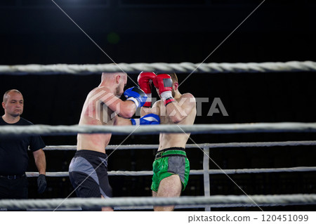 Fierce boxing match showcases athletes' power and skill. Fierce boxing match showcases athletes' power and skill. 120451099