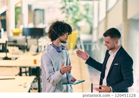 In a modern office setting, an African American businessman and his director confidently extend their hands in congratulations, symbolizing successful resolution of a business problem, amidst a In a modern office setting, an African American businessman and his director confidently extend their hands in congratulations, symbolizing successful resolution of a business problem, amidst a 120451128