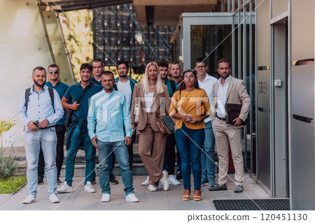 A diverse group of businessmen and colleagues walking together by their workplace, showcasing collaboration and teamwork in the company. 120451130