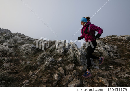 trail running woman athlete training for ultra-marathon race in a mountain trail running woman athlete training for ultra-marathon race in a mountain 120451179
