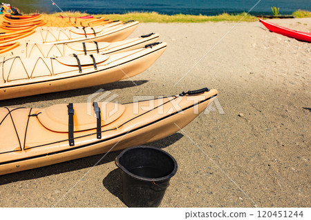 Kayaks on water shore. Kayaks on water shore. 120451244