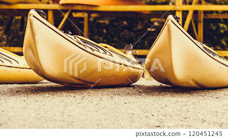 Kayaks on water shore. 120451245