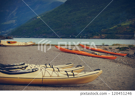 Kayaks on fjord shore, Flam, Norway 120451246
