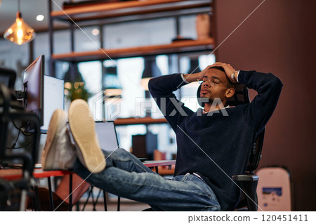 Exhausted African American Programmer Resting at Work. Exhausted African American Programmer Resting at Work. 120451411