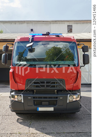 A state-of-the-art firetruck, equipped with advanced rescue technology, stands ready with its skilled firefighting team, prepared to intervene and respond rapidly to emergencies, ensuring the safety 120451466