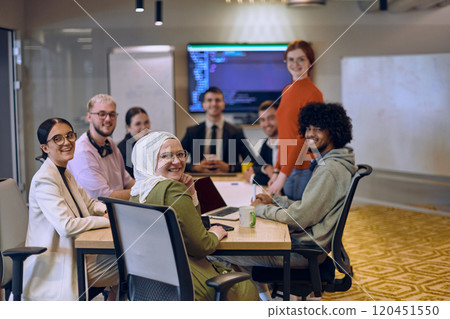 A diverse team of business experts in a modern glass office, attentively listening to a colleague's presentation, fostering collaboration and innovation. A diverse team of business experts in a modern glass office, attentively listening to a colleague's presentation, fostering collaboration and innovation. 120451550