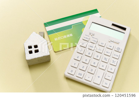 Calculator, bankbook and miniature house Calculator, bankbook and miniature house 120451596