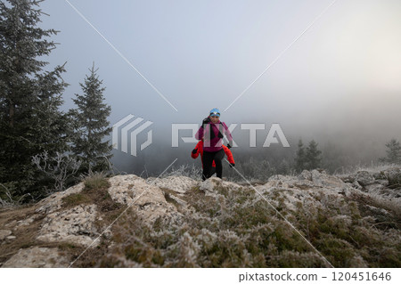 Athlete couple trail running on the mountain top in the early morning. Sky running concept Athlete couple trail running on the mountain top in the early morning. Sky running concept 120451646