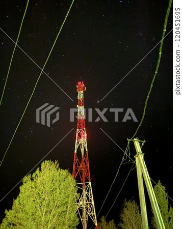 Illuminated Communication Tower Against Starry Night Sky 120451695