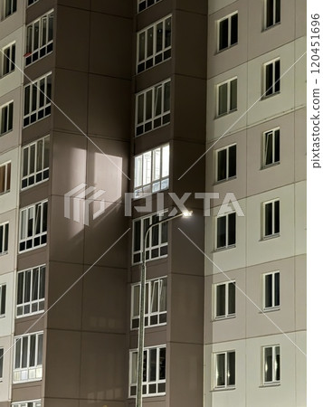 Illuminated Apartment Building at Night with Streetlight Illuminated Apartment Building at Night with Streetlight 120451696