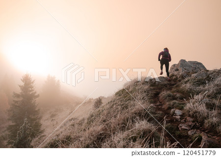 trail running woman athlete training for ultra-marathon race in a mountain trail running woman athlete training for ultra-marathon race in a mountain 120451779
