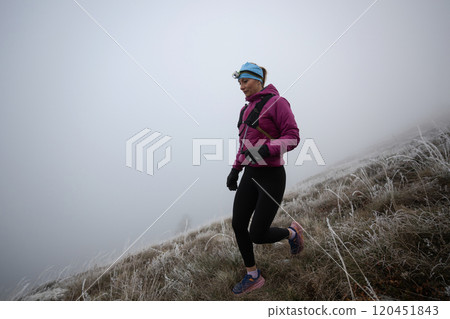 trail running woman athlete training for ultra-marathon race in a mountain trail running woman athlete training for ultra-marathon race in a mountain 120451843