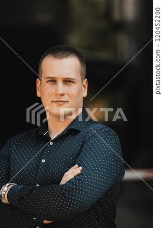 A portrait of a modern man, exuding confidence and style, against an outdoor backdrop, showcasing his charisma and fashionable demeanor. A portrait of a modern man, exuding confidence and style, against an outdoor backdrop, showcasing his charisma and fashionable demeanor. 120452290