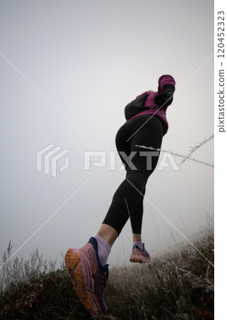 trail running woman athlete training for ultra-marathon race in a mountain trail running woman athlete training for ultra-marathon race in a mountain 120452323