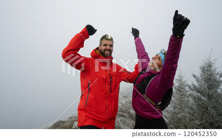 Runner couple having fun after trail cross-country trail running training 120452350