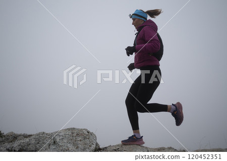 sky running or trail running woman exercising on a mountain top sky running or trail running woman exercising on a mountain top 120452351