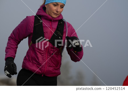 trail running woman athlete training for ultra-marathon race in a mountain trail running woman athlete training for ultra-marathon race in a mountain 120452514